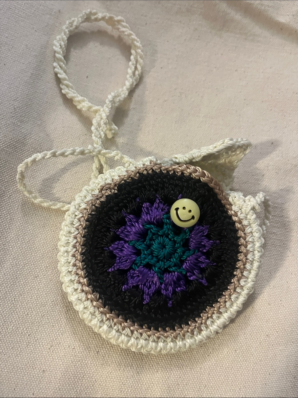 Handmade Cream Crochet Round Crossbody Bag with Black, Purple & Teal Center 101